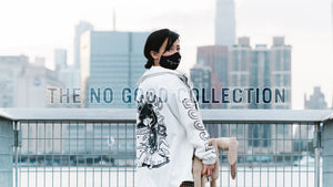 Banner image featuring a female model, wearing the white "No Good" windbreaker
